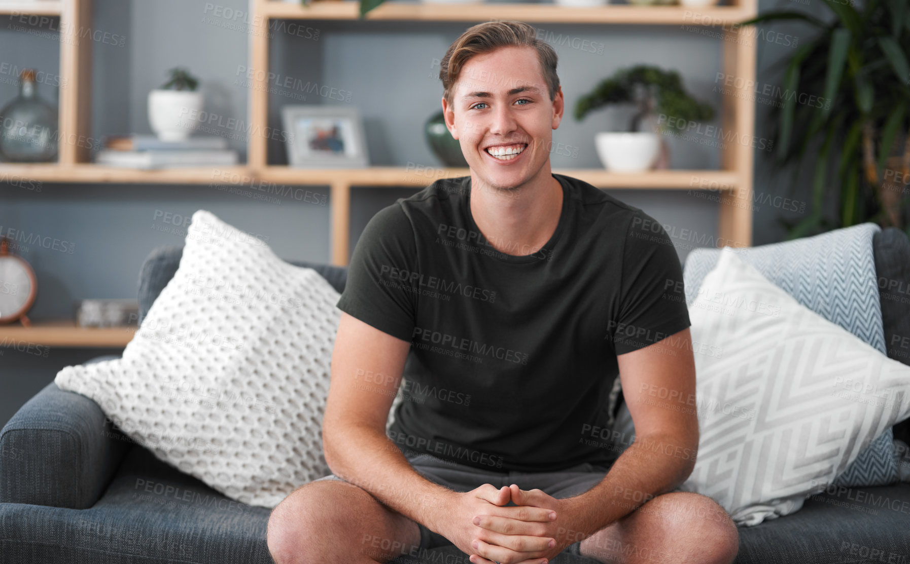 Buy stock photo Smile, portrait and face of man on sofa or home on weekend, free time and lounge. Apartment, calm and happy male on couch in living room for resting, comfortable and relaxation with confidence