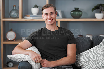 Buy stock photo Man, portrait and face of smile on sofa or home for free time, modern house and lounge. Apartment, calm and happy person on couch in living room for resting, comfortable and relaxation for weekend