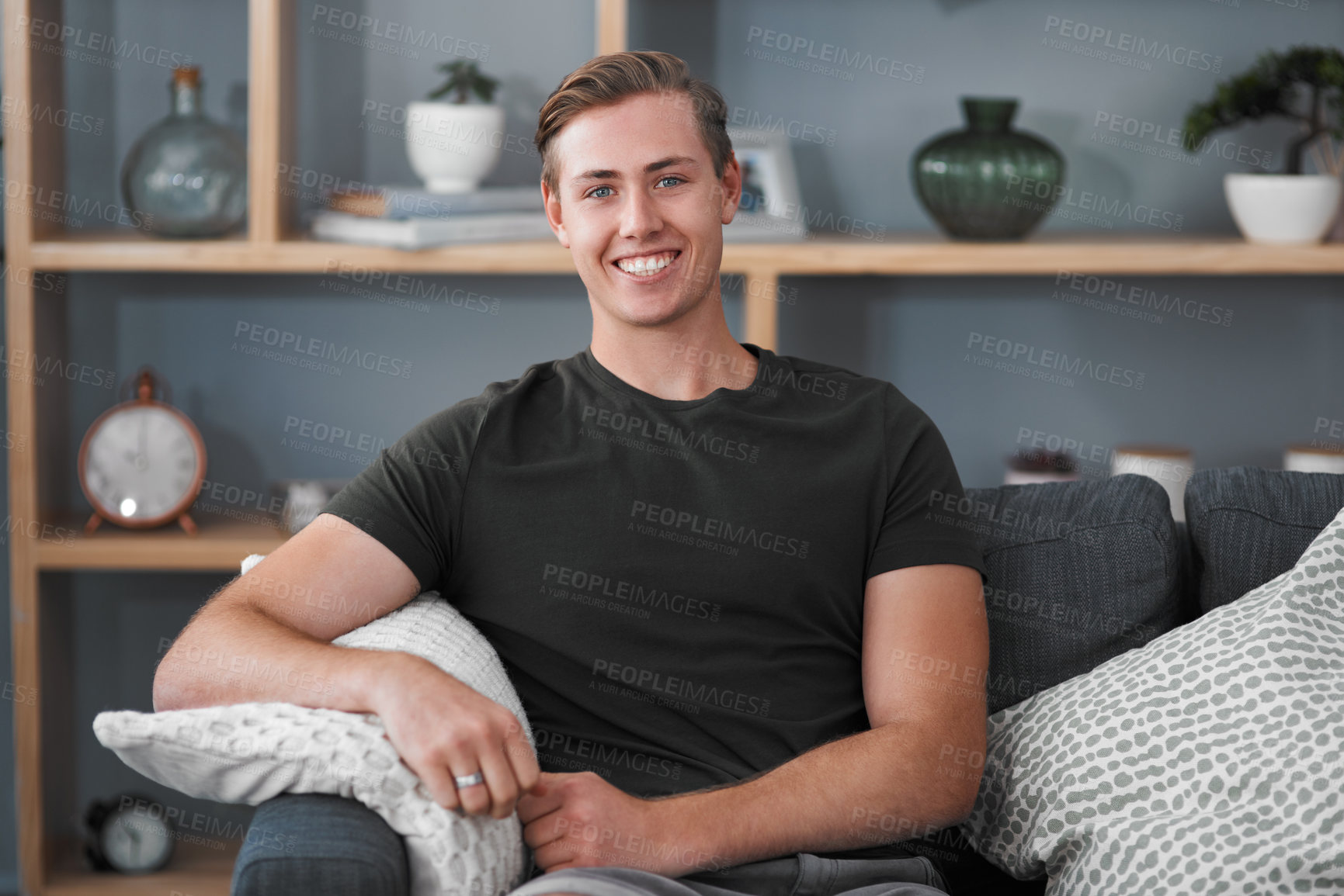 Buy stock photo Man, portrait and face of smile on sofa or home for free time, modern house and lounge. Apartment, calm and happy person on couch in living room for resting, comfortable and relaxation for weekend