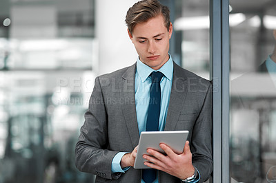 Buy stock photo Office, businessman and corporate with digital tablet for updates, sales or research in workplace. Male professional, online and browsing in business for networking, contact and email or social media