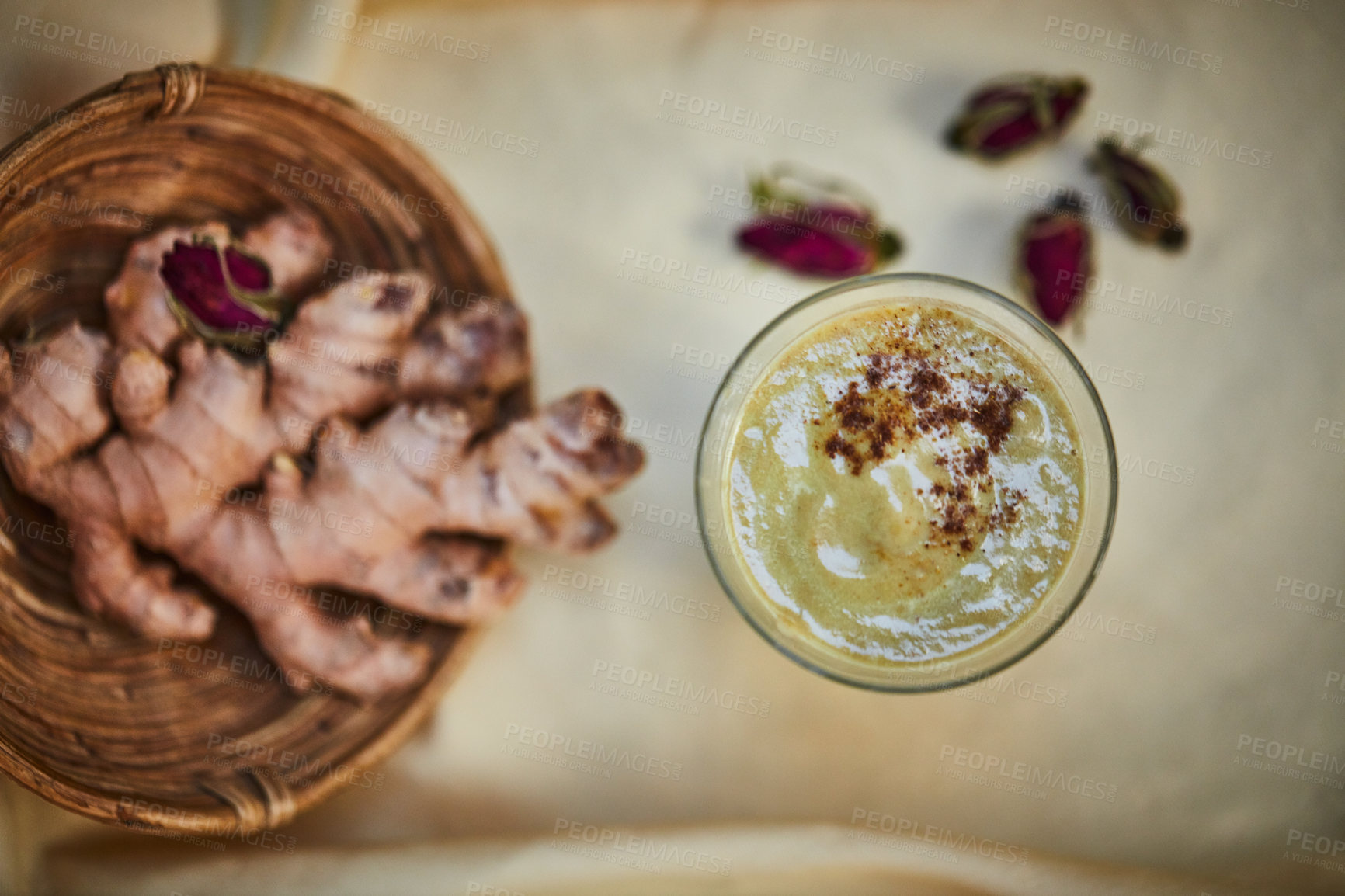 Buy stock photo Shot of a freshly made ginger smoothie on a table