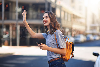 Buy stock photo Phone, smile and taxi with woman on street of city for commute, sightseeing or travel. App, hand gesture and transport with backpacking tourist person hailing cab or ride outdoor in urban town