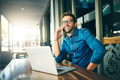 Buy stock photo Man, laptop and happy with phone call at cafe with talking, excited and remote work in morning. Person, writer and contact with networking, smartphone and smile with feedback for story at coffee shop