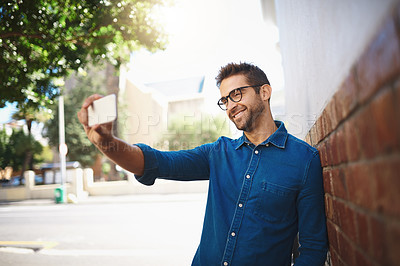 Buy stock photo City, man and smile with selfie for travel, vacation adventure and document memory with picture by wall. Outdoor, male person and influencer with photography for holiday experience, happy and glasses