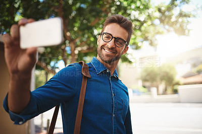 Buy stock photo Happy man, travel and selfie with glasses in city for photography, picture or social media. Young, handsome or male person with smile in joy for memory, capture or outdoor moment in neighborhood