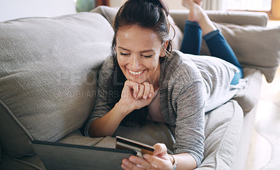 Buy stock photo Woman, home and smile on tablet with debit card on sofa for online shopping, payment and saving plan. Buying, living room and happy on couch for internet banking, budget and investment or finance