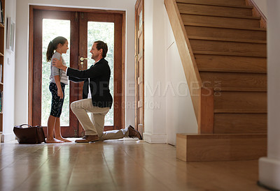 Buy stock photo Full length shot of an affectionate young working father arriving home to his daughter during the day