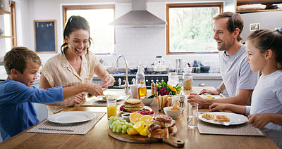 Buy stock photo Happy family, kitchen table and eating breakfast for meal, food and nutrition as healthy diet in morning. Parents, children and house with excited, hungry and together on weekend for bonding in home