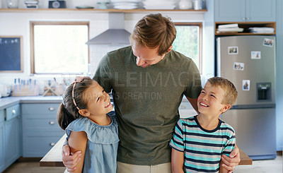 Buy stock photo Cropped shot of an affectionate young father spending time with his two kids in the kitchen at home