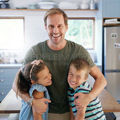 Buy stock photo Cropped shot of an affectionate young father embracing his two kids in their kitchen at home