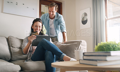 Buy stock photo Couple, living room and tablet with credit card on sofa for online shopping, payment and saving plan. People, smile and happy on couch at home for internet banking, budget and investment or finance