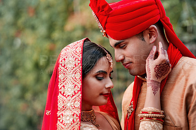 Buy stock photo Cropped shot of a young hindu couple on their wedding day