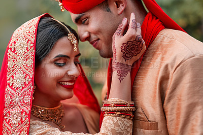 Buy stock photo Wedding, marriage and hand henna with couple together in celebration of love at a ceremony. Happy, romance or islamic with a husband and wife getting married outdoor in tradition of their culture