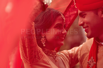Buy stock photo Wedding, marriage and red veil with couple together in celebration of love at a ceremony. Happy, romance or islamic with a hindu bride and groom getting married outdoor in tradition of their culture