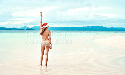 Buy stock photo Woman, peace sign and bikini with Christmas cap on beach for summer, holiday or travel for relax on festive break outdoor. Young lady, laugh and ocean in sun or sand for tropical adventure on mockup