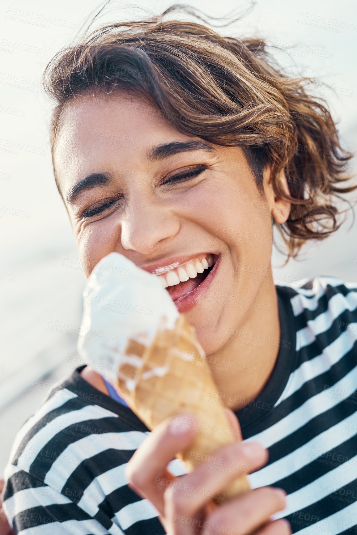 Buy stock photo Girl, laughing and eating ice cream outdoor for summer dessert, sugar snack and enjoy flavour of travel. Woman, funny and eyes closed with gelato cone for food, comedy joke and hungry on vacation