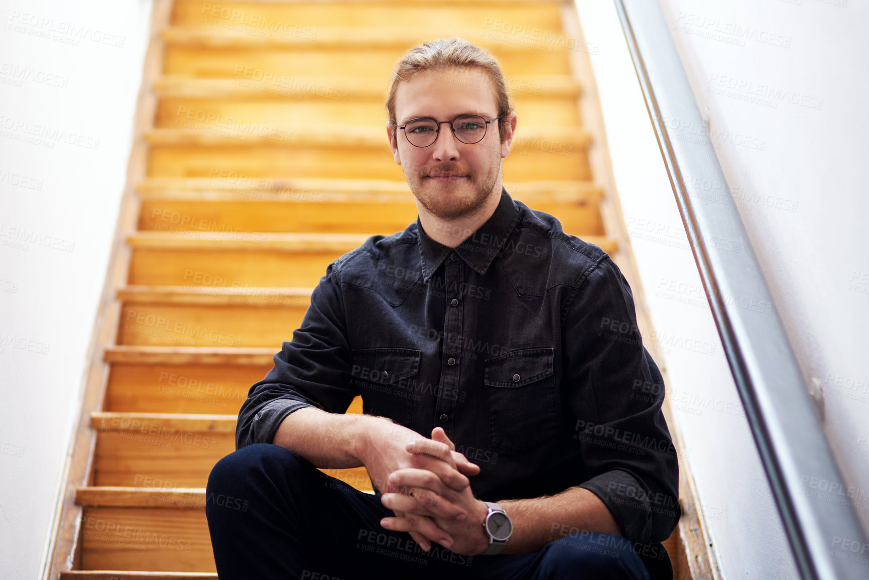 Buy stock photo Man, relax and portrait by stairs in home for enjoyment, satisfaction and peace on weekend. Calm, male person and face with confidence by steps in house for resting, break and chilling in afternoon