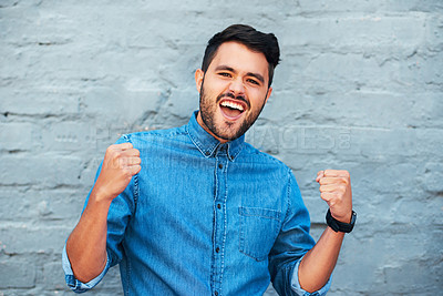 Buy stock photo Celebration, portrait and man by brick wall with success for achievement, energy and winning lottery. Excited, wow and male winner in city with positive feedback for promotion and exclusive discount