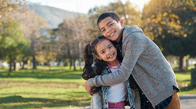 Buy stock photo Park, hug and portrait of brother and sister enjoying summer day for bonding, quality time and playing. Family, children and happy siblings hugging, embrace and loving in nature for relaxing together