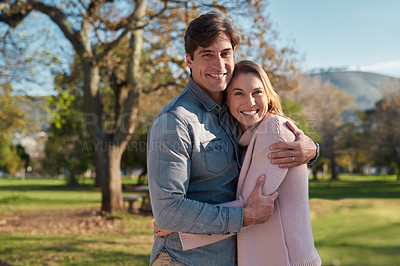 Buy stock photo Couple, portrait and hug for love in nature, face and happy for family vacation or together. Holiday, man and woman bonding at park, commitment and celebration for anniversary or outdoor relationship