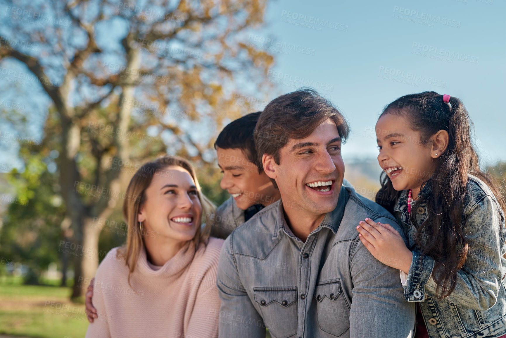 Buy stock photo Family, parents and children in park for bonding, playing and spend time together with smile. Happy people, mother and father with kids outdoor in nature for relaxing, recreation or physical activity