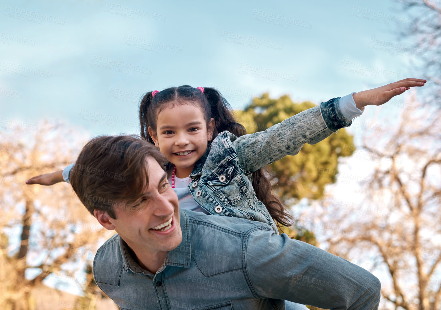 Buy stock photo Portrait, dad and child in nature for piggyback, playing or bonding together with smile. Happy family, parent or father with daughter outdoor in park for motor skills, recreation or physical activity