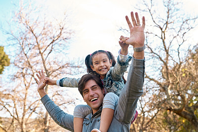 Buy stock photo Shot of an adorable little girl having fun with her father at the park