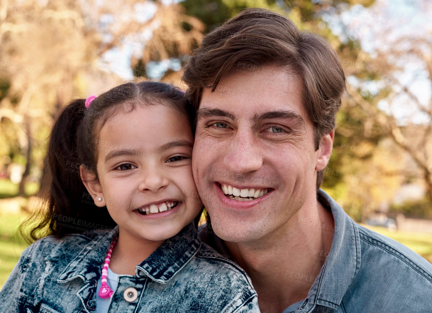 Buy stock photo Shot of an adorable little girl spending quality time with her father at the park