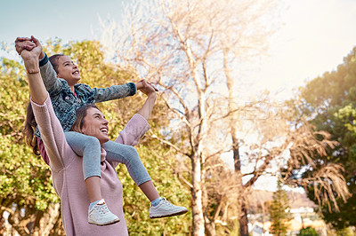 Buy stock photo Shot of an adorable little girl having fun with her mother at the park