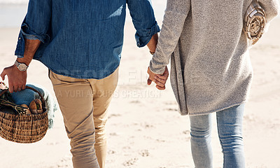Buy stock photo Couple, beach and holding hands for support on vacation date, romance and basket for food or picnic. Friends ,woman and man celebration for community, travel for holiday and solidarity or love