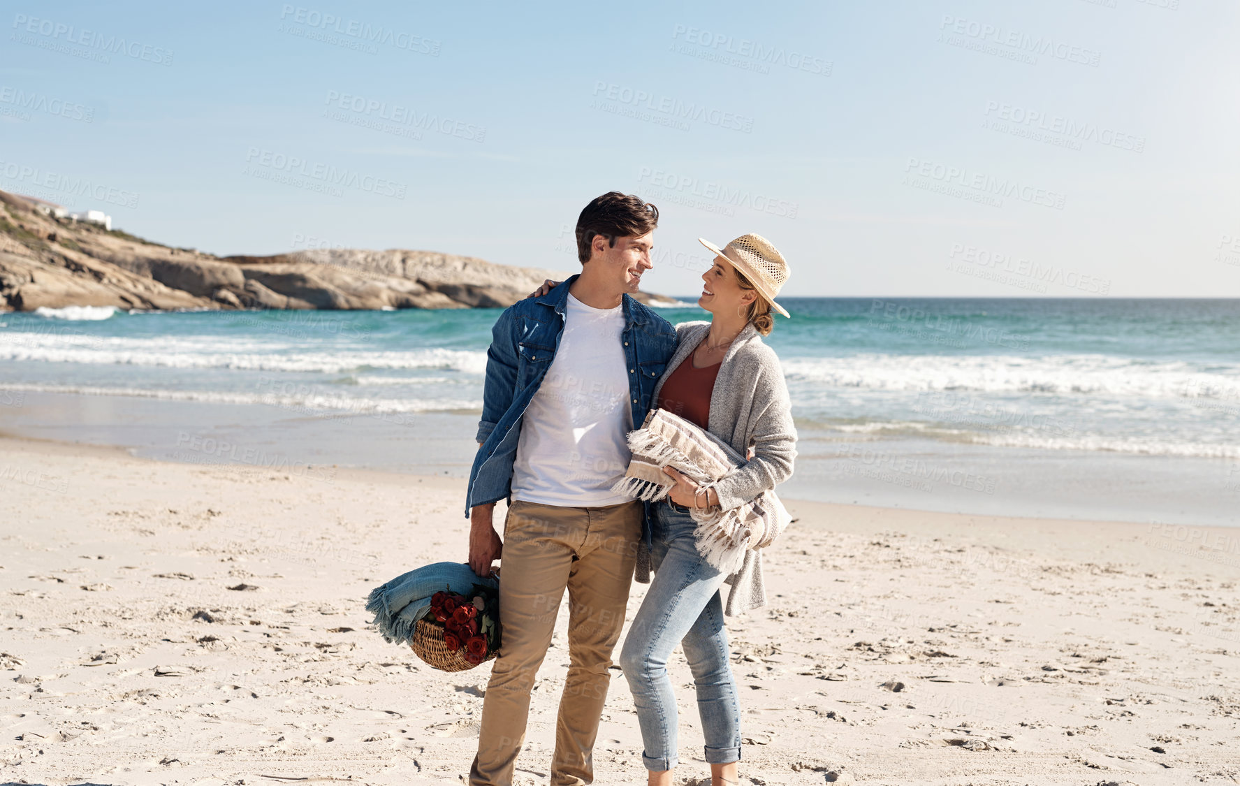 Buy stock photo Couple, happy and picnic at beach with basket for date, holiday and travel in summer for getaway. Vacation, man and woman for anniversary celebration on seashore, leisure and relationship for support