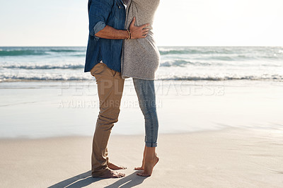 Buy stock photo Cropped shot of an unrecognizable couple spending quality time together on the beach