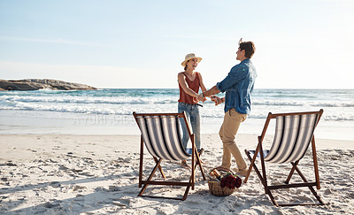Buy stock photo Shot of a middle aged couple dancing on the beach