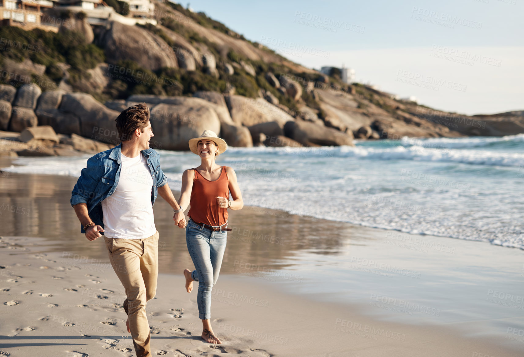 Buy stock photo Couple, beach and holding hands in running, happy and holiday for vacation, ocean and cropped shot.  Romantic, summer and travel, bonding and sea or outdoor, sand and romance in miami for honeymoon