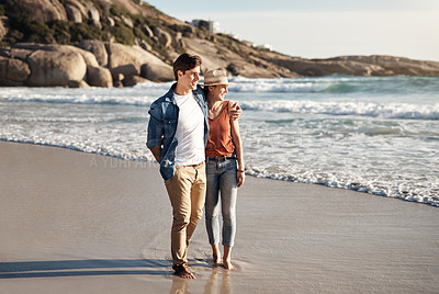 Buy stock photo Couple, sand and walking on beach with hug for sunshine, holiday romance, love together and honeymoon. Woman, man and peaceful walk in ocean for summer vacation, trust and relationship in Argentina