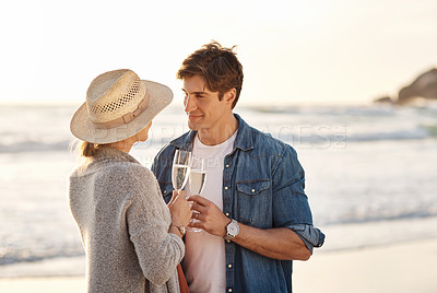 Buy stock photo Sunset, beach and couple with drink of champagne on vacation with happiness at luxury villa in France. Marriage, holiday and people relax outdoor at sea together with wine and enjoy ocean on date