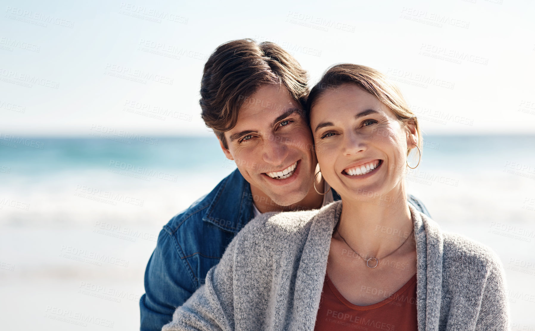 Buy stock photo Couple, love and smile in portrait on beach or vacation with ocean, waves and sunshine. Holiday, marriage and relax with adventure for relationship growth on anniversary in the Maldives in outdoor