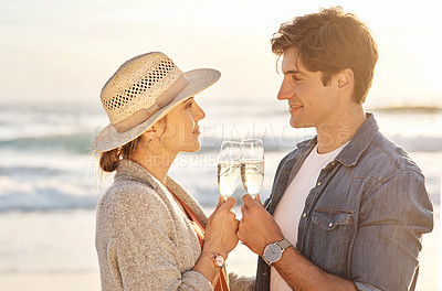 Buy stock photo Sunset, drink and couple on beach with champagne on vacation with happiness at celebration in France. Marriage, holiday or people relax at sea together with wine, cocktail and cheers to date at ocean