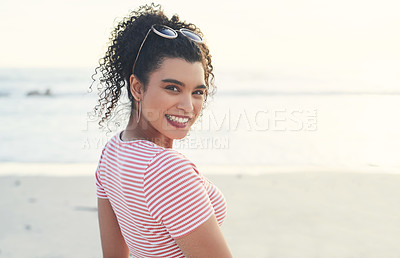 Buy stock photo Cropped shot of a beautiful young woman spending the day at the beach