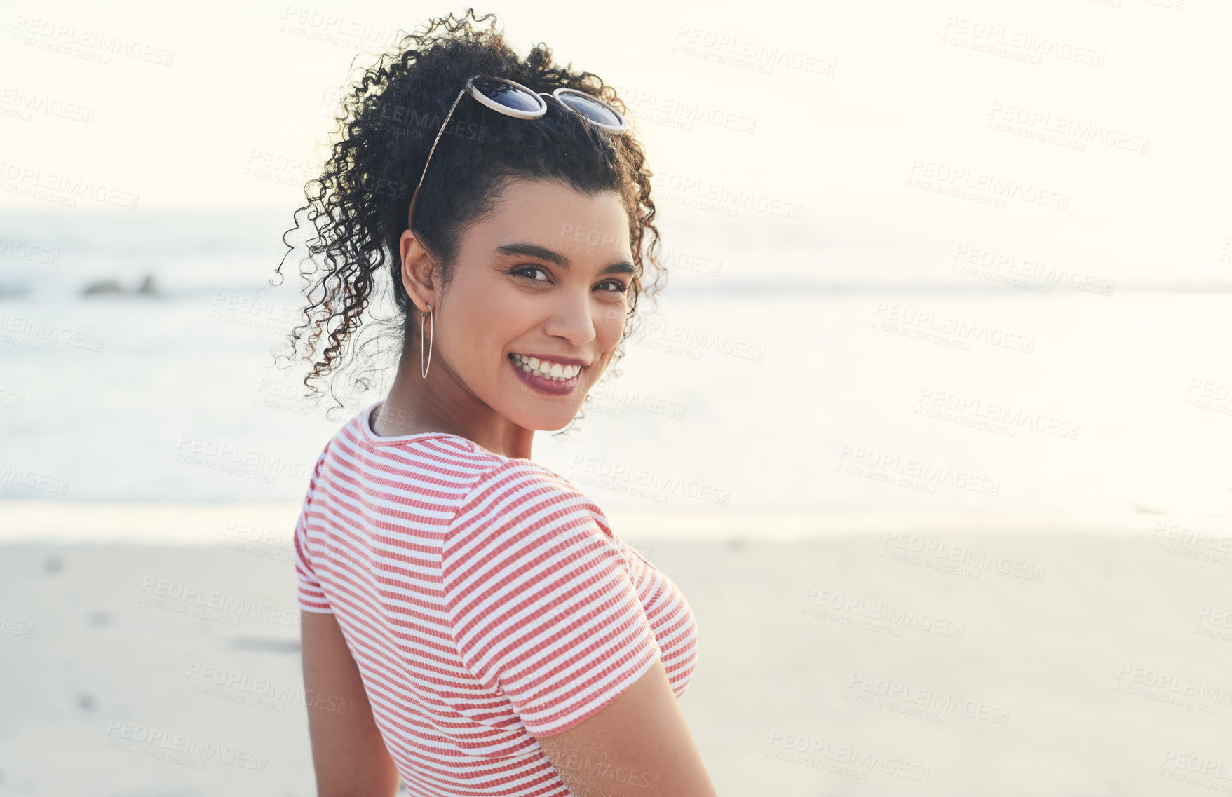 Buy stock photo Smile, beach and portrait of woman with travel, vacation or getaway for self discovery journey. Happy, calm and female person by ocean for seaside holiday, adventure or weekend trip in Barcelona.