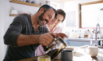 Buy stock photo Cropped shot of a middle aged couple having coffee in the morning