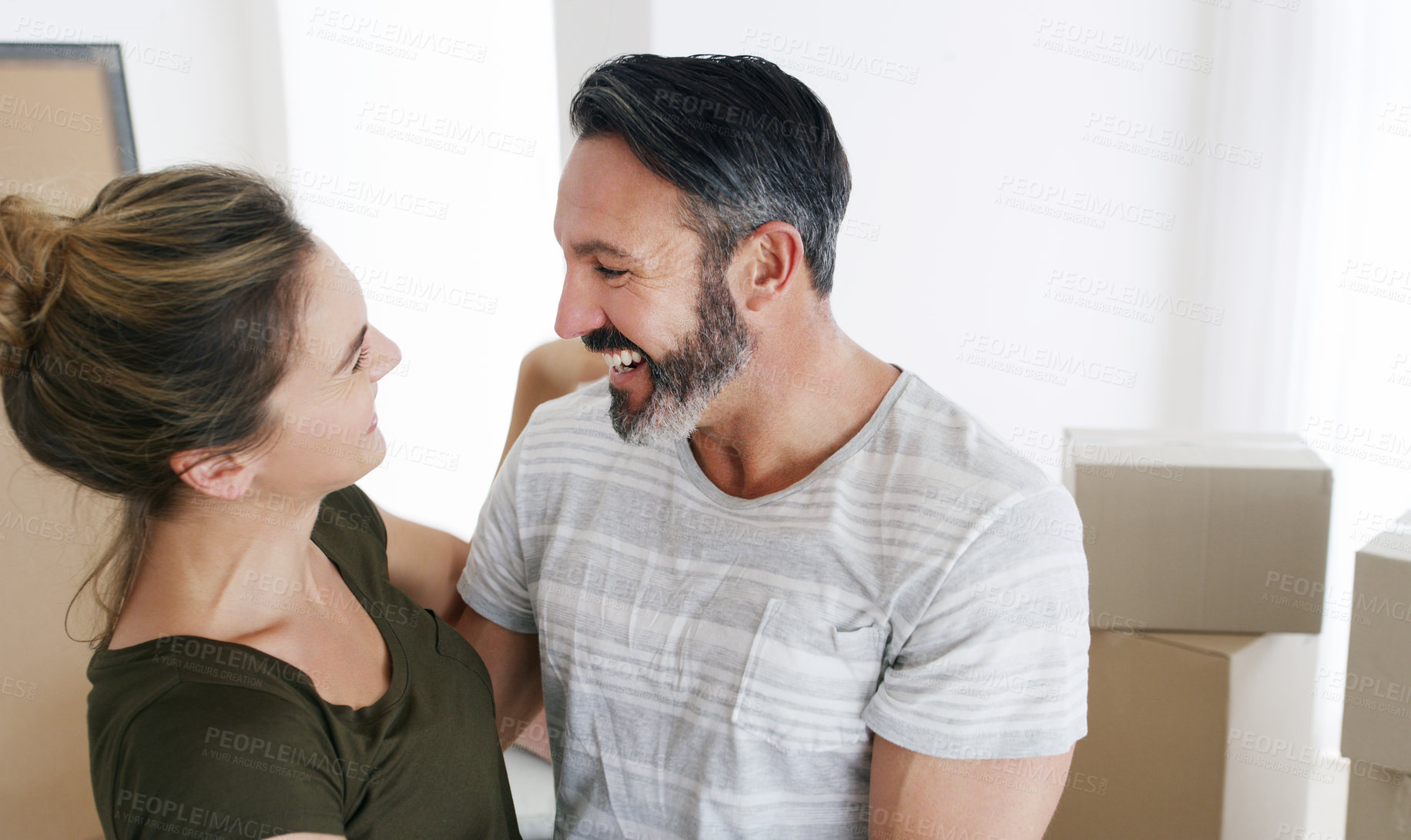 Buy stock photo Cropped shot of a middle aged couple moving into their new home