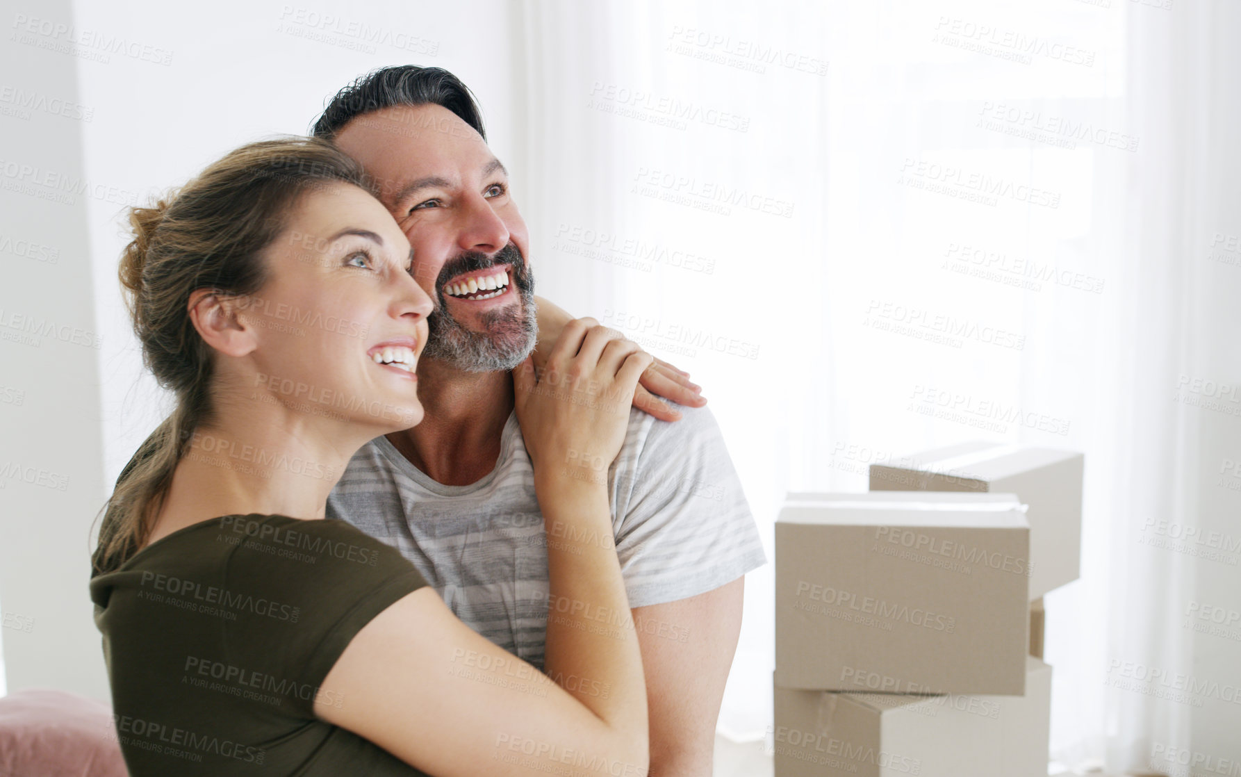 Buy stock photo Cropped shot of a middle aged couple moving into their new home