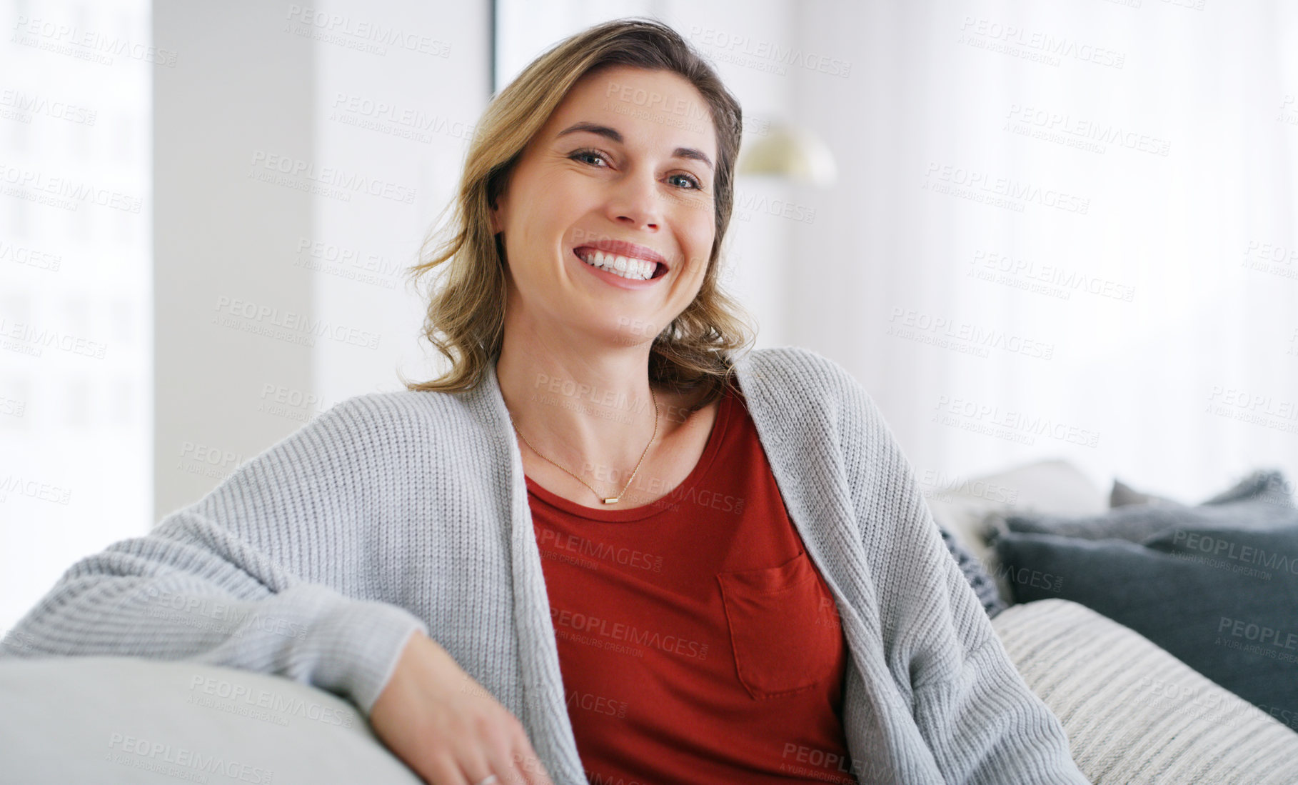 Buy stock photo Cropped shot of a middle aged woman relaxing at home