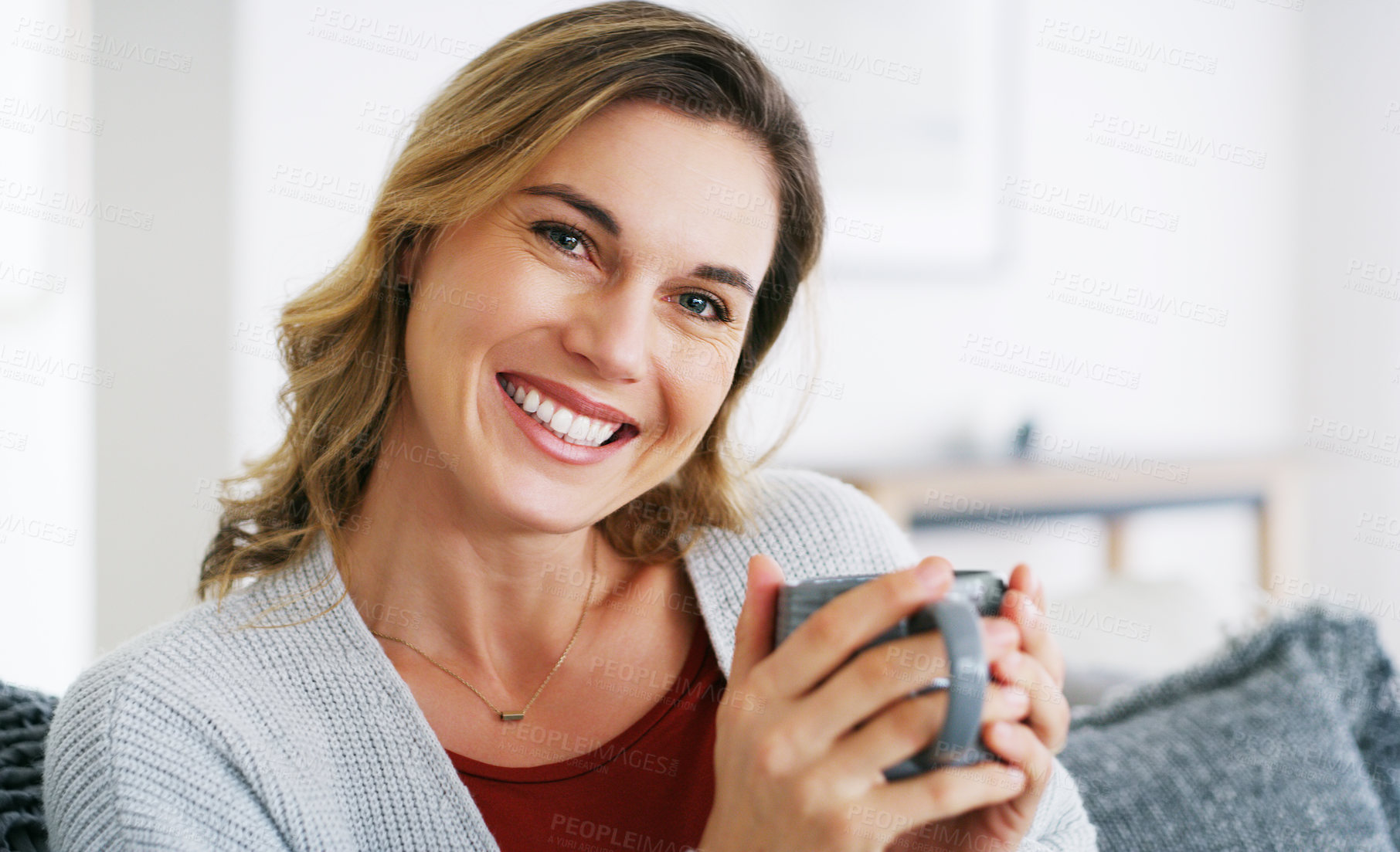 Buy stock photo Cropped shot of a middle aged woman relaxing at home