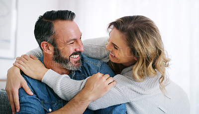 Buy stock photo Cropped shot of an affectionate couple relaxing together at home