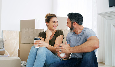 Buy stock photo Cropped shot of a middle aged couple moving into their new home