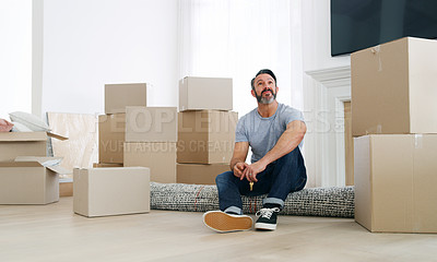 Buy stock photo Shot of a middle aged man moving into his new home