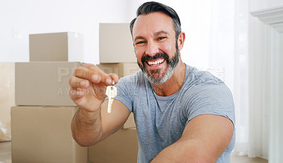 Buy stock photo Shot of a middle aged man holding the key to his new home