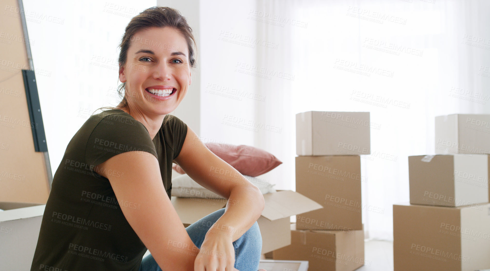 Buy stock photo Shot of a middle aged woman moving into her new home